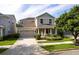 A charming two-story home with a well-kept lawn, attached two car garage and inviting entrance at 7113 Park Tree Dr, Tampa, FL 33625