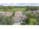 Aerial shot of attractive home boasting manicured landscaping next to a lush golf course at 7507 Ascot Ct, University Park, FL 34201