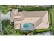 Overhead drone shot of the home's layout, screened in pool, and tile roof at 7507 Ascot Ct, Bradenton, FL 34201