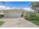 Lovely exterior with a large three car garage, beautiful landscaping, and a paver driveway at 7507 Ascot Ct, University Park, FL 34201