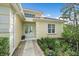 Inviting home exterior featuring manicured landscaping, double door entry, and great natural light at 7507 Ascot Ct, Bradenton, FL 34201