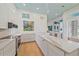 Well-lit kitchen with granite countertops, stainless steel appliances, and ample storage at 7507 Ascot Ct, Bradenton, FL 34201