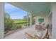 Screened-in patio with comfortable seating, perfect for enjoying the views of the meticulously maintained backyard at 7507 Ascot Ct, Bradenton, FL 34201