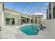 Spacious screened pool with various seating arrangements and lots of natural light creates inviting outdoor space at 7507 Ascot Ct, University Park, FL 34201