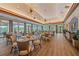 Upscale restaurant with large windows, elegant tables, and a view of the lush golf course at 7507 Ascot Ct, Bradenton, FL 34201