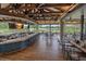 Outdoor restaurant view with a full bar, lake view and multiple table and chair settings at 7507 Ascot Ct, University Park, FL 34201