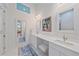 Bright bathroom with double vanities, ample counter space, and modern fixtures at 7507 Ascot Ct, University Park, FL 34201