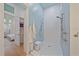 Modern walk-in shower with sleek tiling and fixtures located off the main bedroom at 7507 Ascot Ct, University Park, FL 34201