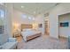 Spacious main bedroom with high ceilings, large windows, and ensuite bathroom access at 7507 Ascot Ct, University Park, FL 34201