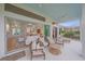 Inviting outdoor patio with comfortable seating, seamlessly connecting to the interior living space through sliding glass doors at 7507 Ascot Ct, University Park, FL 34201