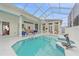 Screened-in pool with outdoor seating, accessible from multiple points in the home at 7507 Ascot Ct, University Park, FL 34201