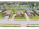 Aerial view of the home highlighting the backyard, pond, and landscaping at 7508 Ripetta St, Sarasota, FL 34240