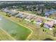 Aerial view of the neighborhood highlighting backyard pools and ponds at 7508 Ripetta St, Sarasota, FL 34240