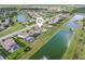 An aerial view of the home showcasing its proximity to the lake and neighborhood amenities at 7508 Ripetta St, Sarasota, FL 34240
