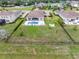 An aerial view of the backyard featuring a private pool, fire pit, and fenced yard at 7508 Ripetta St, Sarasota, FL 34240