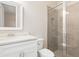 Bathroom featuring white vanity with a marble countertop, toilet, and glass enclosed shower at 7508 Ripetta St, Sarasota, FL 34240