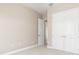A bedroom featuring neutral colors, baseboards, carpet, closet, and entry way into the room at 7508 Ripetta St, Sarasota, FL 34240