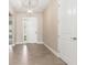 Inviting entryway with neutral paint, tile flooring, a pendant light, and a white front door at 7508 Ripetta St, Sarasota, FL 34240