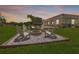 Backyard featuring a cozy fire pit area, perfect for outdoor gatherings and relaxation at 7508 Ripetta St, Sarasota, FL 34240