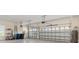 An open garage showcasing a multi-car capacity, with visible mechanical components and storage solutions at 7508 Ripetta St, Sarasota, FL 34240