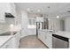 Well-appointed kitchen with stainless steel appliances, granite countertops, and white cabinets at 7508 Ripetta St, Sarasota, FL 34240