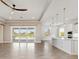 Open living room boasts tile floors, recessed lighting, and a sliding glass door to the pool area at 7508 Ripetta St, Sarasota, FL 34240