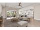 Bright and airy living room with a view of the pool, open to the kitchen at 7508 Ripetta St, Sarasota, FL 34240