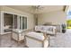 An outdoor space with comfortable seating, a ceiling fan, and a built-in grill at 7508 Ripetta St, Sarasota, FL 34240