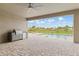 Outdoor patio with a built-in outdoor kitchen area, pavers, and a view of the in-ground pool and backyard at 7508 Ripetta St, Sarasota, FL 34240