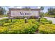 Stone community welcome sign with 'VILANO' against lush landscaping at 7508 Ripetta St, Sarasota, FL 34240