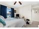 Cozy bedroom with ceiling fan, window, closet and en suite bathroom at 8638 Bessemer Ave, North Port, FL 34287