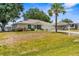 Charming single-Gathering home with well-manicured front lawn and mature trees at 8638 Bessemer Ave, North Port, FL 34287