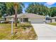Well-kept single-Gathering home with front lawn and a spacious driveway at 8638 Bessemer Ave, North Port, FL 34287