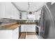 Beautiful kitchen with stainless steel appliances, granite counters, and ample cabinet space at 8638 Bessemer Ave, North Port, FL 34287