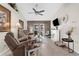 Inviting living room with wood-look accent wall, fireplace, and comfortable seating at 8638 Bessemer Ave, North Port, FL 34287