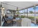 Screened-in patio offering a relaxing outdoor space for dining and entertaining at 8638 Bessemer Ave, North Port, FL 34287