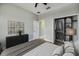 Bright bedroom with a view of closet, light grey walls and dark furniture at 8640 Stone Harbour Loop, Bradenton, FL 34212