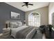 Beautiful bedroom featuring a ceiling fan, stylish decor, and a window allowing ample natural light at 8640 Stone Harbour Loop, Bradenton, FL 34212