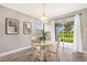 Cozy dining area with sliding glass doors providing views of the outdoor space at 8640 Stone Harbour Loop, Bradenton, FL 34212