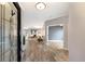 Foyer with hardwood flooring leads to a bright living space featuring modern interiors at 8640 Stone Harbour Loop, Bradenton, FL 34212