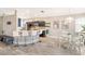Modern kitchen featuring stainless steel appliances, breakfast bar seating and dining area at 8640 Stone Harbour Loop, Bradenton, FL 34212