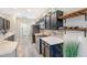 Modern kitchen featuring stainless steel appliances, light countertops, and dark wood cabinets at 8640 Stone Harbour Loop, Bradenton, FL 34212
