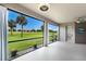 This is an outdoor lanai with a stunning view of the golf course and blue sky at 8640 Stone Harbour Loop, Bradenton, FL 34212