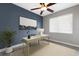 Office space with natural light, ceiling fan, stylish desk setup, and modern decor for a productive workspace at 8640 Stone Harbour Loop, Bradenton, FL 34212