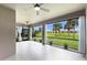 Large screened patio with view of green space, ceiling fans, and room to enjoy outdoors at 8640 Stone Harbour Loop, Bradenton, FL 34212
