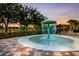 Fun splash pad with a water feature and surrounding seating area, perfect for Gathering enjoyment at 8640 Stone Harbour Loop, Bradenton, FL 34212