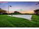 Outdoor sand volleyball court surrounded by lush greenery, perfect for recreational activities at 8640 Stone Harbour Loop, Bradenton, FL 34212