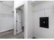 Spacious walk-in closet featuring a secure safe, ample shelving, and modern flooring at 8640 Stone Harbour Loop, Bradenton, FL 34212