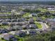 Panoramic aerial view of a community featuring residential neighborhoods and a scenic lake at 8932 Isabella Cir, Parrish, FL 34219