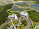 Community aerial view showcasing the pool, clubhouse, lakes, landscaping, and winding roads at 8932 Isabella Cir, Parrish, FL 34219